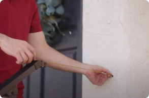 Step 2: Measure the distance from your top handrail post to the wall